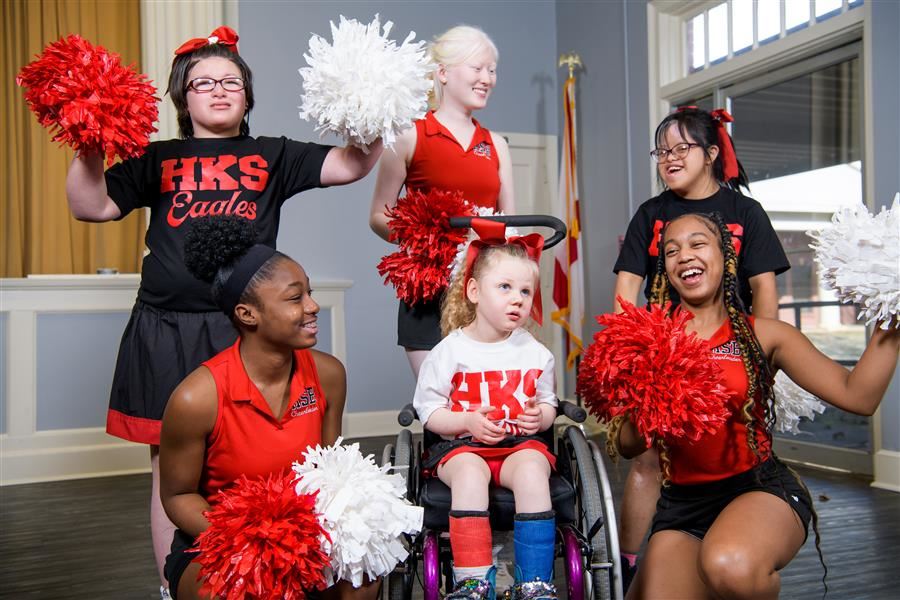  3 HKS cheerleaders cheering with cheerleaders from Alabama School for the Blind.